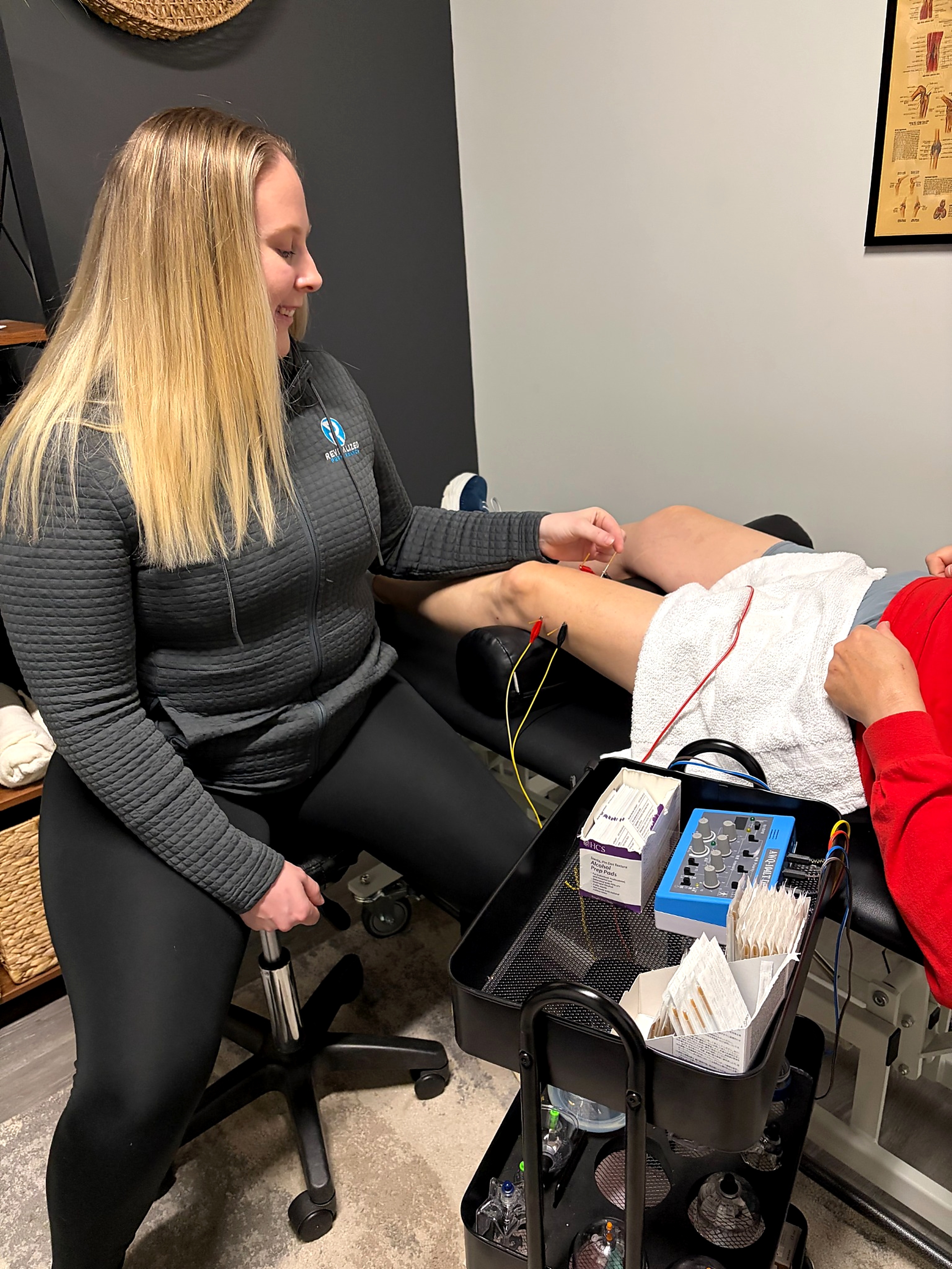 Patient working with a provider at a physical therapy clinic in Manchester, NH during a functional movement assessment