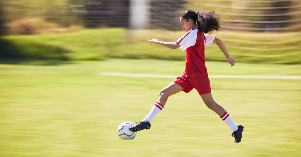 teen-girl-kicking-soccer-ball-on-the-field-2026-01-09-11-02-01-utc